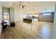 Open-concept living space features hardwood floors, a ceiling fan and an open design at 6376 Sw 117Th Street Rd, Ocala, FL 34476