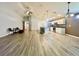 Open-concept living space features hardwood floors, a ceiling fan and an open design at 6376 Sw 117Th Street Rd, Ocala, FL 34476