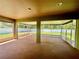 Enclosed, screened patio offers a versatile space for outdoor living and entertaining at 6376 Sw 117Th Street Rd, Ocala, FL 34476