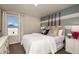 Bright bedroom featuring a stylish accent wall, a comfortable bed, and complementary decor at 774 Ambleside Ave, Haines City, FL 33844