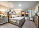 Elegant bedroom with a luxurious bed, stylish decor, and large windows with scenic views at 774 Ambleside Ave, Haines City, FL 33844