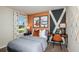 Inviting bedroom with a modern desk, chair, and natural light from the window at 774 Ambleside Ave, Haines City, FL 33844