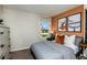 Cozy bedroom with a window, dark grey bedding, and natural light at 774 Ambleside Ave, Haines City, FL 33844