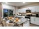 Beautiful kitchen with stainless appliances, a center island with seating, and elegant finishes, creating a perfect gathering space at 774 Ambleside Ave, Haines City, FL 33844