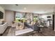 Bright living area with open layout, stylish furniture, and seamless flow to kitchen and dining areas, perfect for entertaining at 774 Ambleside Ave, Haines City, FL 33844