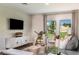 Comfortable living room featuring modern decor, plush seating, and bright natural light at 774 Ambleside Ave, Haines City, FL 33844