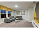 Comfortable living room featuring a plush sectional sofa, modern decor, and ample natural light at 774 Ambleside Ave, Haines City, FL 33844