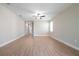 Spacious living room with durable hardwood flooring and a modern ceiling fan at 7890 Somersworth Dr, Kissimmee, FL 34747