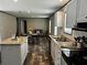 Spacious kitchen and dining area with lots of natural light and clean countertops at 9494 Se 144Th Pl, Summerfield, FL 34491