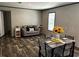 Comfortable living room area with attractive floors and neutral colored furniture and decorations at 9494 Se 144Th Pl, Summerfield, FL 34491