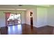 Dining room with hardwood floors, chandelier, and access to outdoor patio at 12430 Blue Heron Way, Leesburg, FL 34788
