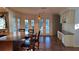 Kitchen with bar seating, granite counters, and stainless steel appliances at 12430 Blue Heron Way, Leesburg, FL 34788