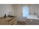 Laundry room with sink, cabinetry, and modern washer and dryer at 12430 Blue Heron Way, Leesburg, FL 34788