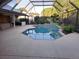 Screened-in pool area featuring an inviting pool at 12430 Blue Heron Way, Leesburg, FL 34788