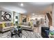 Spacious living room featuring modern decor, plush seating, and an open floor plan leading to the kitchen at 1609 Sage Ave, Haines City, FL 33844