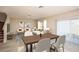 Open-concept living and dining area featuring modern furnishings, neutral decor, and bright natural light at 1617 Sage Ave, Haines City, FL 33844
