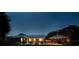 Exterior twilight shot with a pool and gazebo, set against a backdrop of mature trees and sky at 3610 Amber Ln, Lakeland, FL 33812