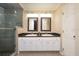 Well-lit bathroom features double sinks with granite vanity and a glass-enclosed shower at 3610 Amber Ln, Lakeland, FL 33812