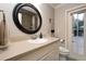 Bathroom features a single sink vanity, toilet, and door to outside at 3610 Amber Ln, Lakeland, FL 33812
