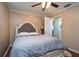 Bedroom featuring hardwood floors, a ceiling fan, and comfortable queen bed at 3610 Amber Ln, Lakeland, FL 33812