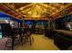 Outdoor gazebo with dining set, barbecue grill, and warm lighting, perfect for evening gatherings at 3610 Amber Ln, Lakeland, FL 33812