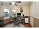 Home office with a ceiling fan, hardwood floors, and a computer desk at 3610 Amber Ln, Lakeland, FL 33812