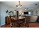 Open dining and living area with hardwood floors, stone fireplace, and comfortable seating at 3610 Amber Ln, Lakeland, FL 33812
