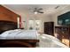 Comfortable main bedroom with ceiling fan and dresser, and natural lighting at 3610 Amber Ln, Lakeland, FL 33812