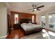 Spacious main bedroom with a king bed, ceiling fan, and access to the lanai at 3610 Amber Ln, Lakeland, FL 33812
