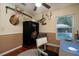 Cozy office featuring hardwood floors, decorative animal mounts, and a secure Cannon safe at 3610 Amber Ln, Lakeland, FL 33812