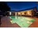 Backyard view showcases a sparkling private pool and the home's exterior with a covered patio at 3610 Amber Ln, Lakeland, FL 33812