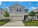 Inviting two-story home with a well-manicured lawn and attached two-car garage at 4035 Gardenia Ave, Lake Hamilton, FL 33851