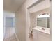 Bathroom with vanity and mirror, plus toilet visible and hallway to the left at 6255 Christina Ct, Orlando, FL 32810