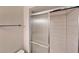 Bathroom featuring a shower with glass doors and white tiled walls at 6255 Christina Ct, Orlando, FL 32810