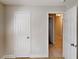 Bedroom with closet with views to hallway with adjacent rooms and tile flooring at 6255 Christina Ct, Orlando, FL 32810