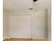 This bedroom includes a large closet with bi-fold doors and neutral paint at 6255 Christina Ct, Orlando, FL 32810