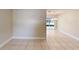 Open dining area featuring neutral walls, tile flooring, and a view of the outdoor patio at 6255 Christina Ct, Orlando, FL 32810
