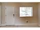 Welcoming entryway with a white front door and natural light from the window at 6255 Christina Ct, Orlando, FL 32810