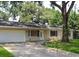 Charming single-story home with a two-car garage and a well-maintained lawn at 6255 Christina Ct, Orlando, FL 32810