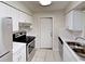 Bright kitchen with white cabinets, stainless steel appliances, and tiled backsplash at 6255 Christina Ct, Orlando, FL 32810