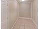 This room features neutral paint, tiled floors, and a utility closet at 6255 Christina Ct, Orlando, FL 32810
