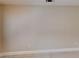 Neutral wall with a tile floor, electrical outlet, and modern baseboard at 6255 Christina Ct, Orlando, FL 32810
