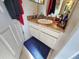 Well lit bathroom with white cabinets, granite countertop, and blue accent rug at 205 Golf Aire Blvd, Haines City, FL 33844