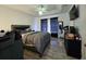 Bedroom boasts natural light, hardwood floors, and neutral colors for a relaxing atmosphere at 205 Golf Aire Blvd, Haines City, FL 33844