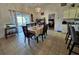 Inviting dining area with a sliding glass door allowing for natural light and outdoor views at 205 Golf Aire Blvd, Haines City, FL 33844
