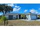 Charming single-story home with a well-manicured lawn, a two car garage, and a nicely painted exterior at 205 Golf Aire Blvd, Haines City, FL 33844