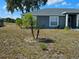 Charming home with a well-maintained front yard and manicured landscaping at 205 Golf Aire Blvd, Haines City, FL 33844