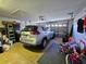 Spacious garage with a car, overhead lighting, and ample storage space at 205 Golf Aire Blvd, Haines City, FL 33844