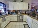 Efficient kitchen with stainless steel appliances and white cabinets at 205 Golf Aire Blvd, Haines City, FL 33844