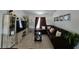 Comfortable living room with a large sectional sofa, entertainment center, and modern decor at 205 Golf Aire Blvd, Haines City, FL 33844